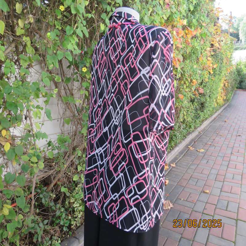 ANNA PIA black sheer polyester sheer polyester top with pink-white link print. Size large 44