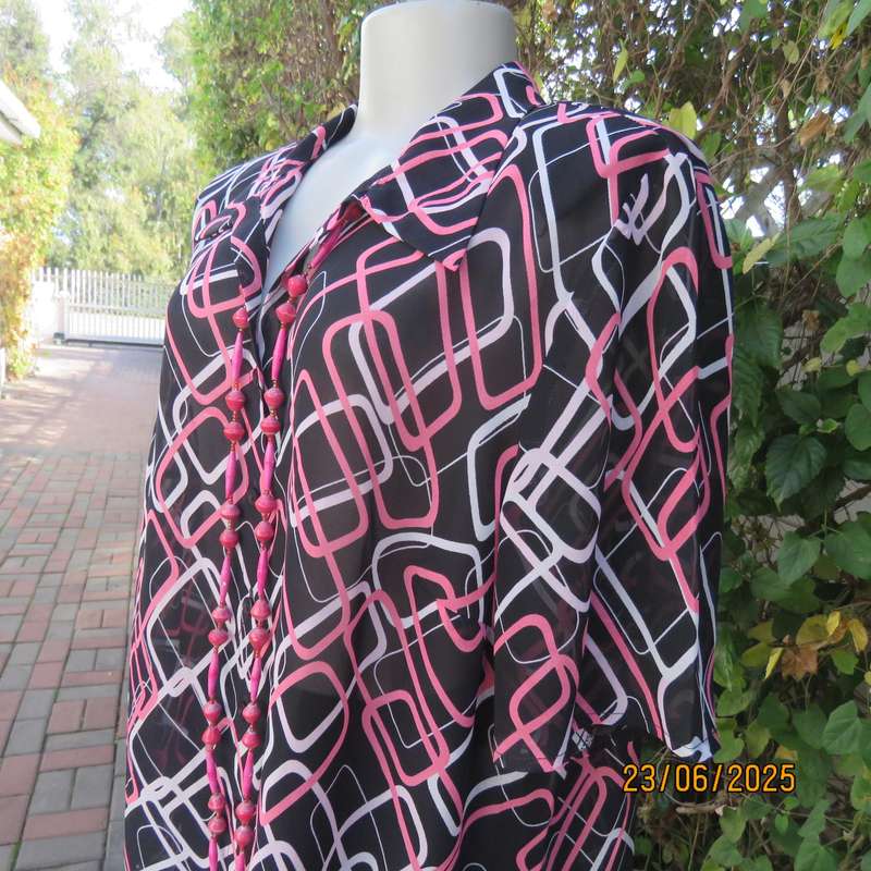 ANNA PIA black sheer polyester sheer polyester top with pink-white link print. Size large 44