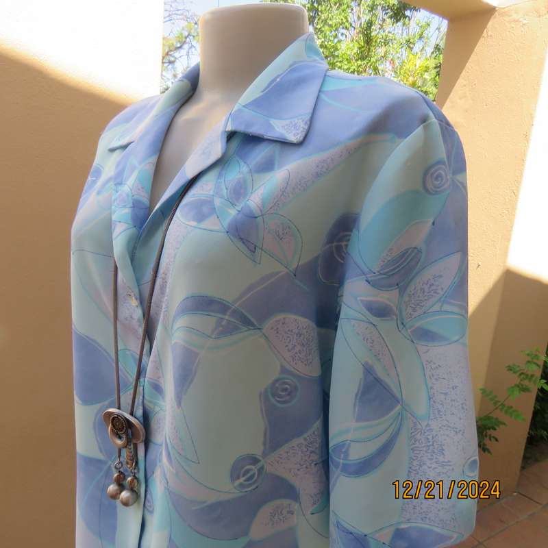 Charming short sleeve button down-open collar top in medley of cool blue shades.Size 42-44.As new