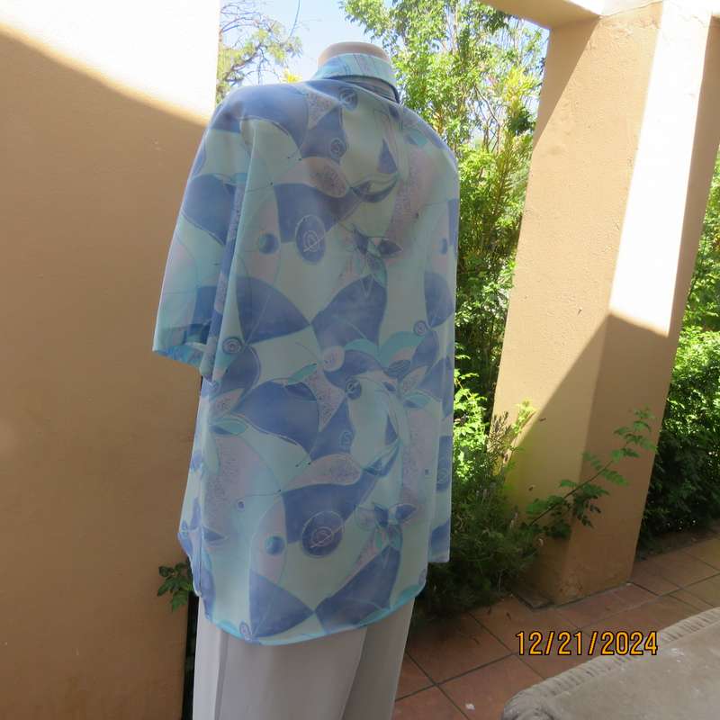 Charming short sleeve button down-open collar top in medley of cool blue shades.Size 42-44.As new
