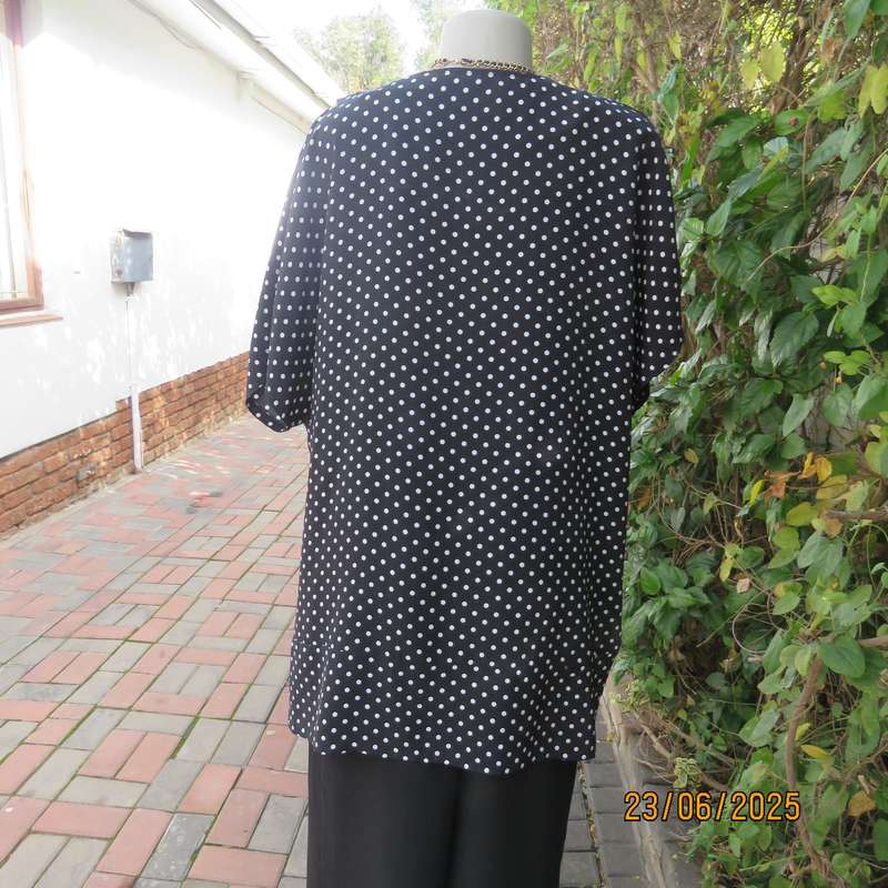 Boutique made black silky polyester top with white polkadots. Size 48. Fold over neckline.