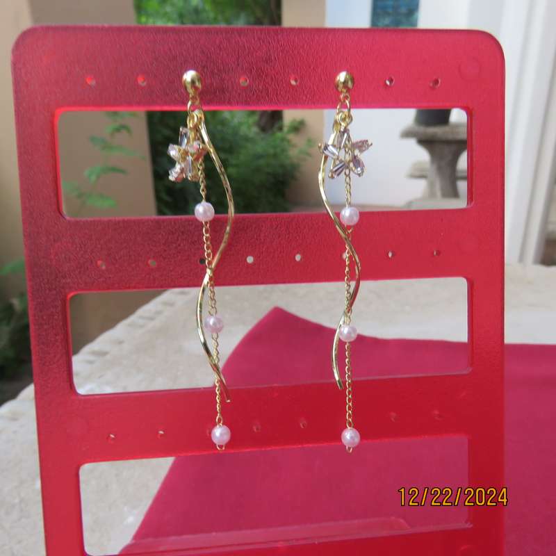 Pair of dainty golden long hanging earrings with thin chain with faux pearls. New item