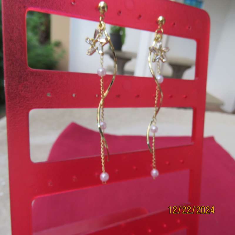 Pair of dainty golden long hanging earrings with thin chain with faux pearls. New item
