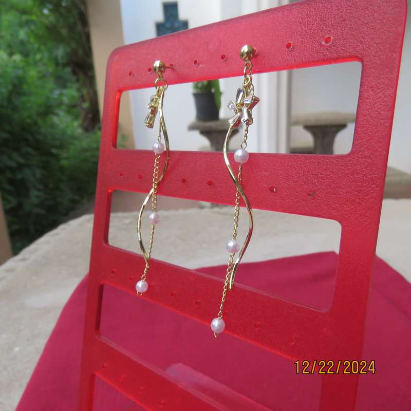 Pair of dainty golden long hanging earrings with thin chain with faux pearls. New item