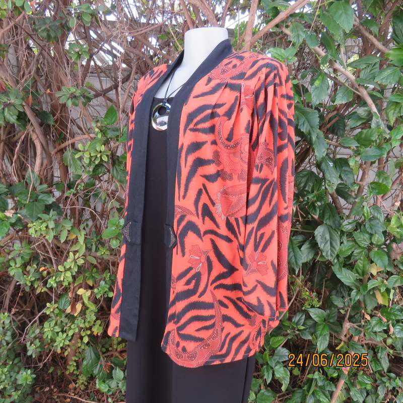 Burnt orange-black bohemian print long open front top. Kimono style sleeves. Size 44