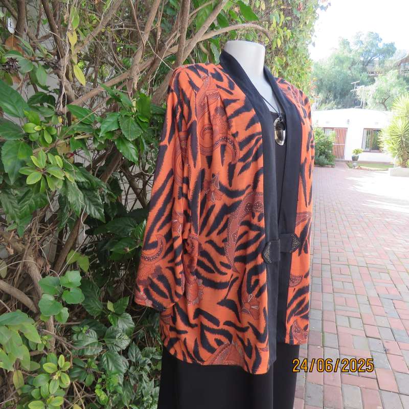 Burnt orange-black bohemian print long open front top. Kimono style sleeves. Size 44