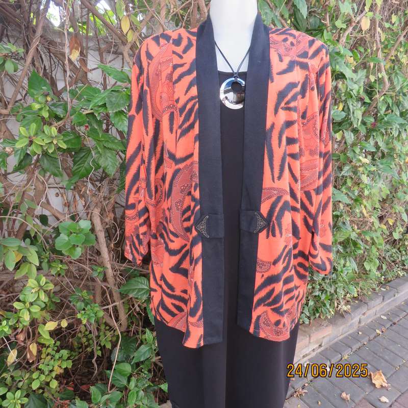 Burnt orange-black bohemian print long open front top. Kimono style sleeves. Size 44