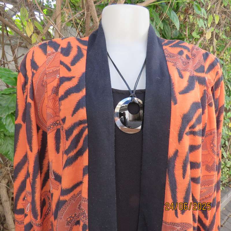 Burnt orange-black bohemian print long open front top. Kimono style sleeves. Size 44