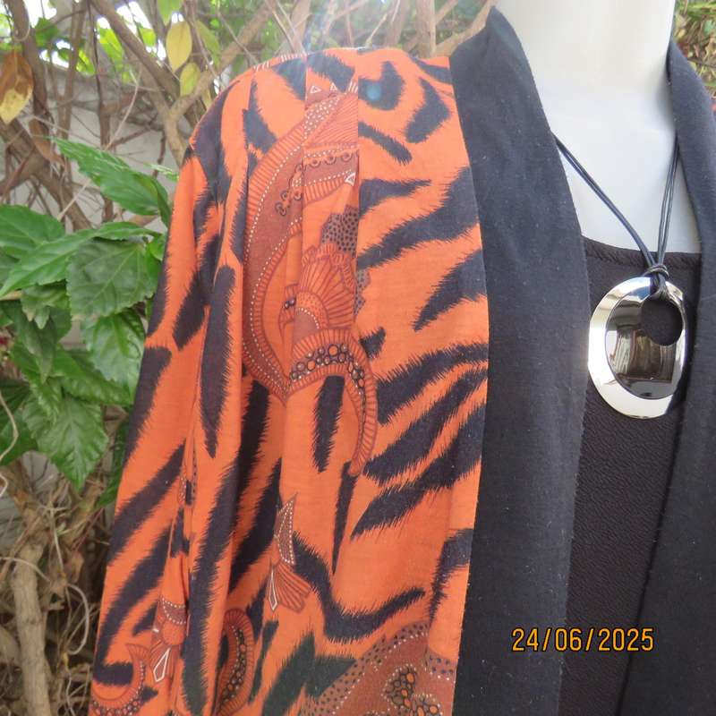 Burnt orange-black bohemian print long open front top. Kimono style sleeves. Size 44
