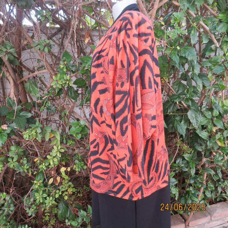Burnt orange-black bohemian print long open front top. Kimono style sleeves. Size 44