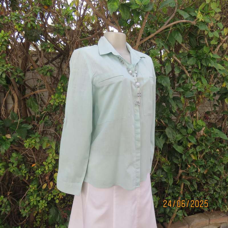 WOOLWORTHS mint green long sleeve cotton shirt size 34. Unique front pockets.