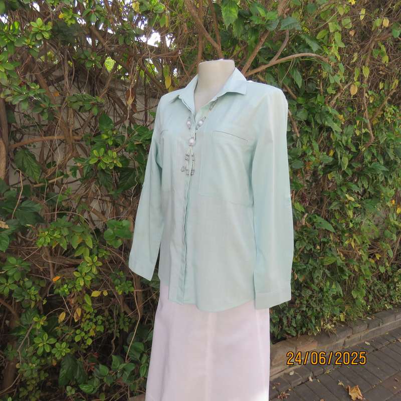 WOOLWORTHS mint green long sleeve cotton shirt size 34. Unique front pockets.