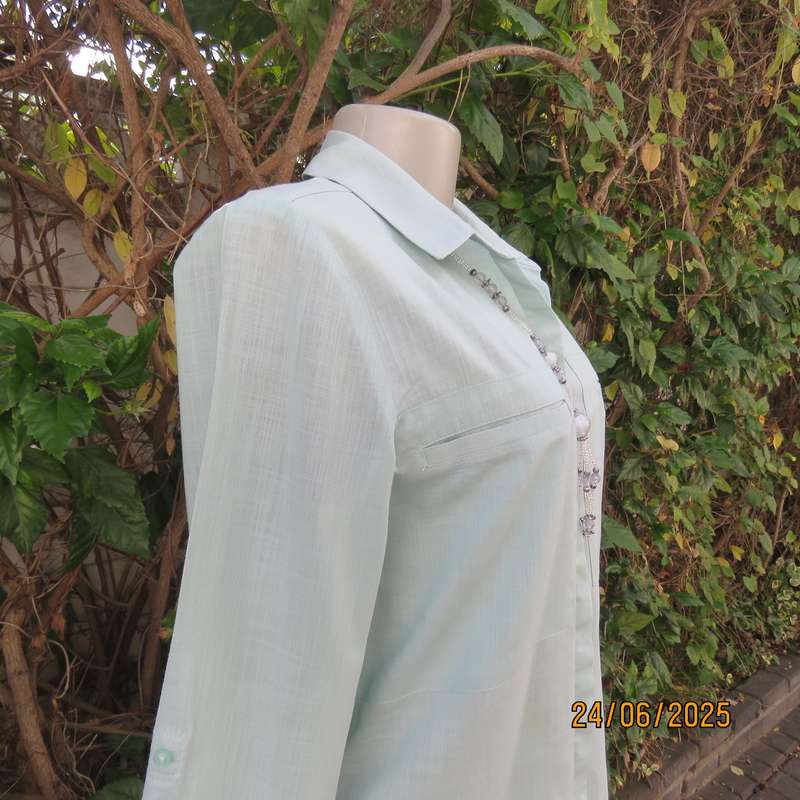 WOOLWORTHS mint green long sleeve cotton shirt size 34. Unique front pockets.