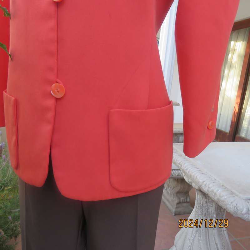 Stunning boutique made papaya colour long sleeve lined collarless jacket.Size 38.Poly-viscose blend.