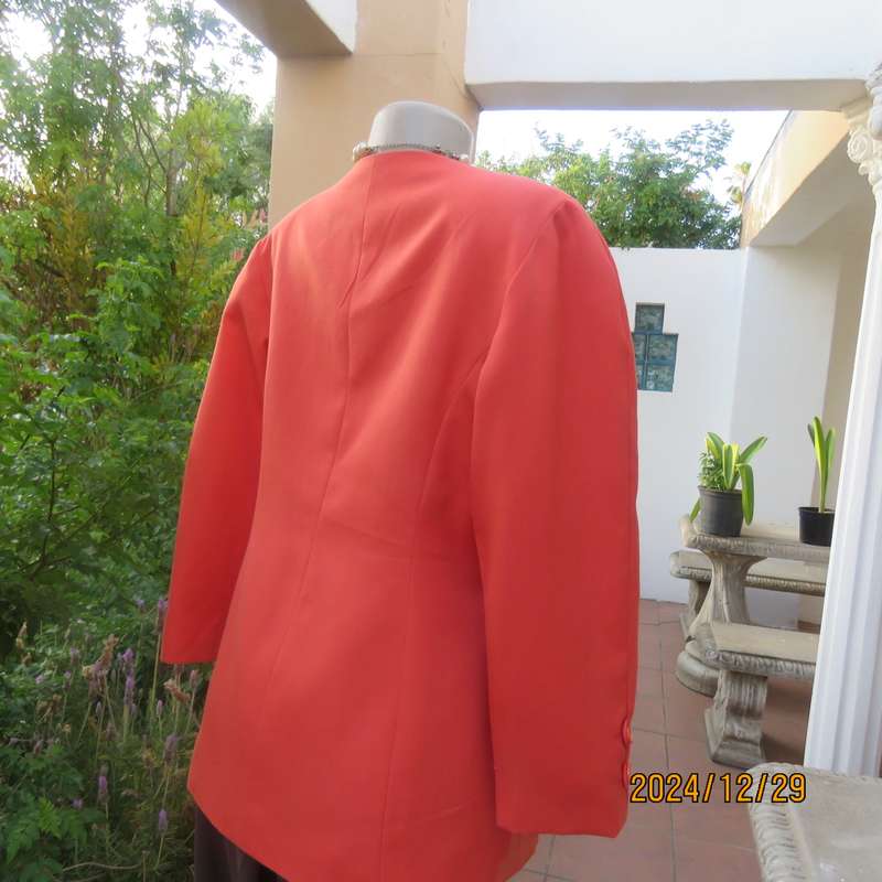 Stunning boutique made papaya colour long sleeve lined collarless jacket.Size 38.Poly-viscose blend.