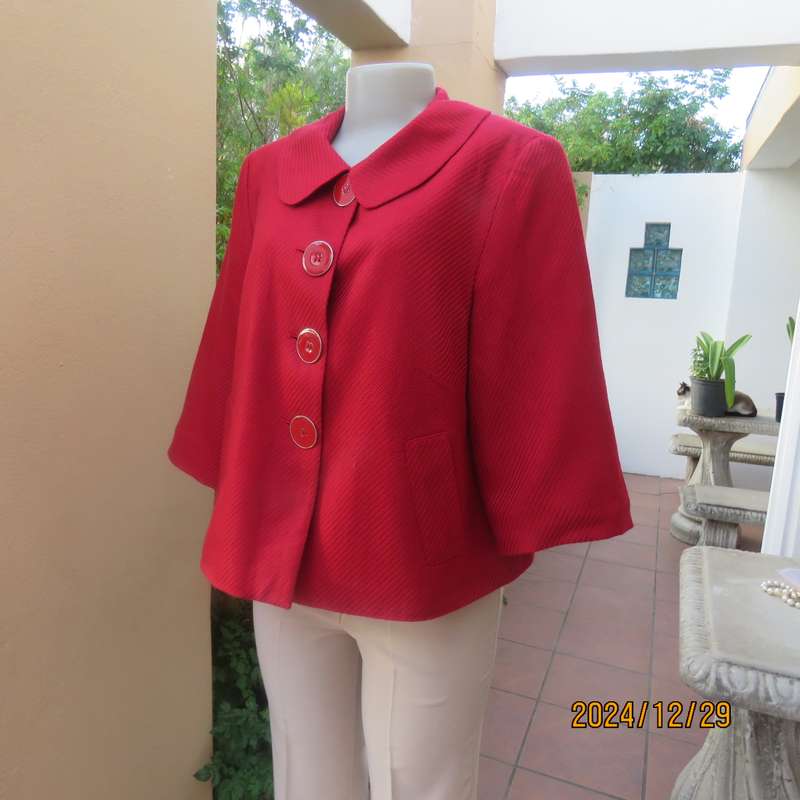 High quality red LTD Woman fly away short jacket in ribbed acrylic.Fully lined. Size 38. As new.