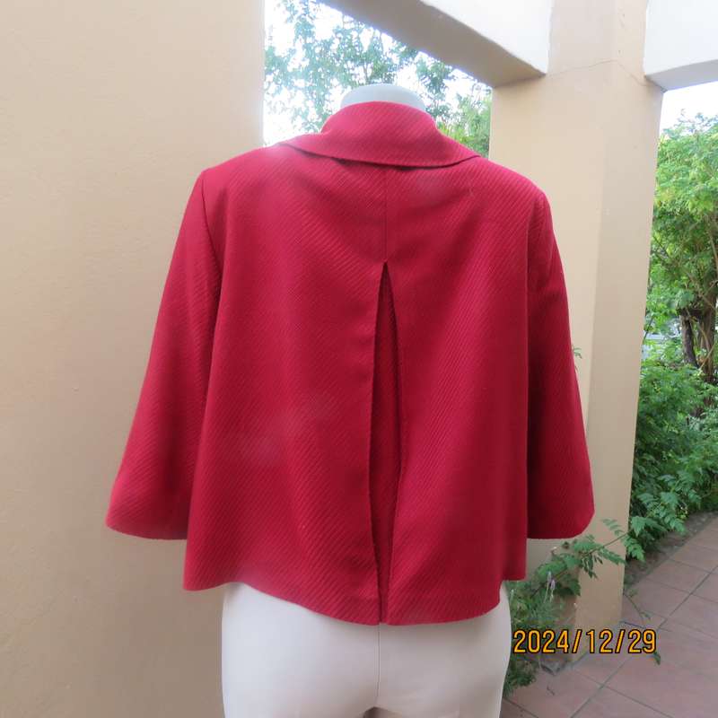 High quality red LTD Woman fly away short jacket in ribbed acrylic.Fully lined. Size 38. As new.