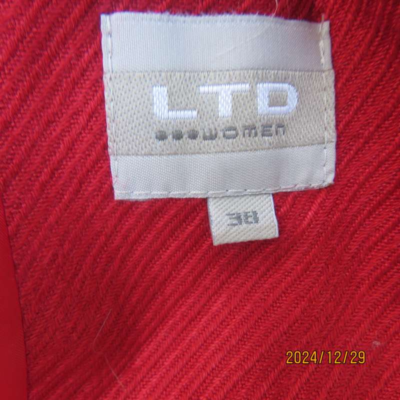 High quality red LTD Woman fly away short jacket in ribbed acrylic.Fully lined. Size 38. As new.