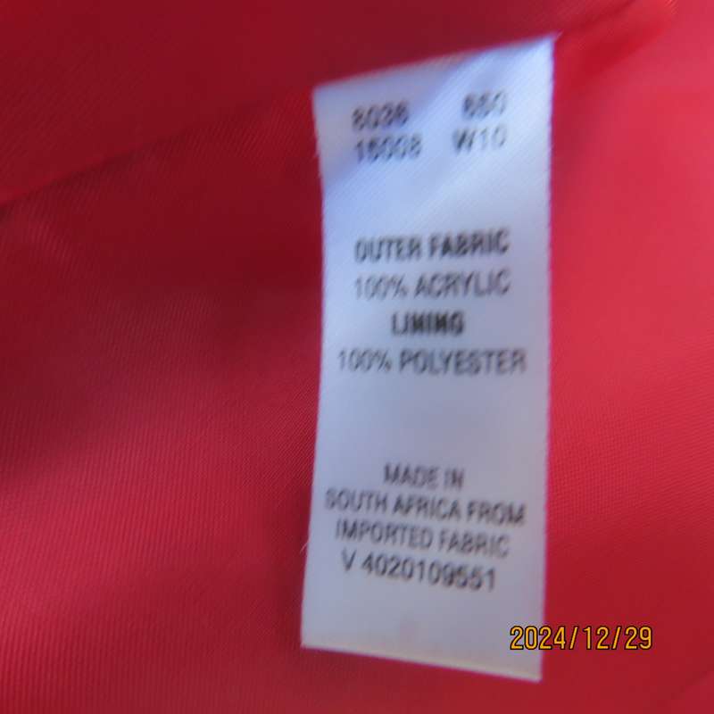 High quality red LTD Woman fly away short jacket in ribbed acrylic.Fully lined. Size 38. As new.