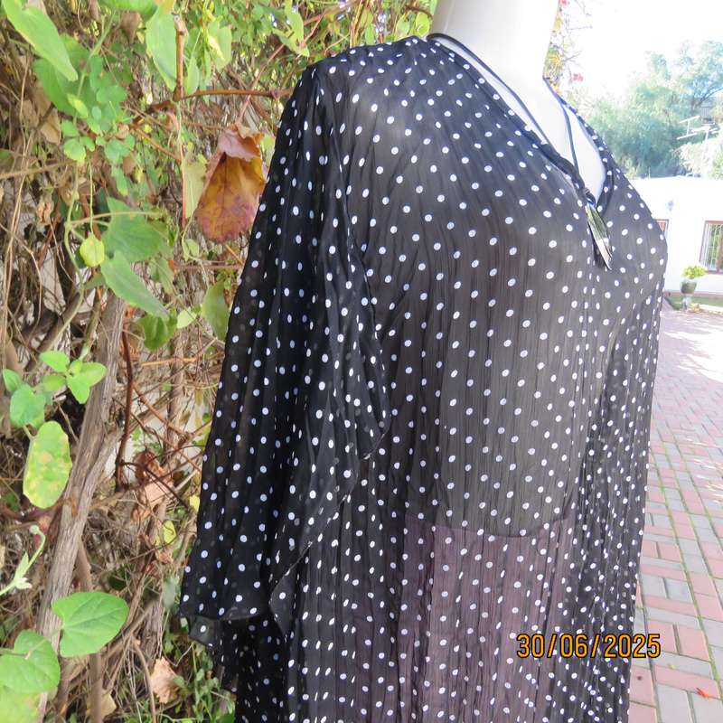 DONNA CLAIRE sheer black-white polkadot pleated top. Size 48. Open elbow sleeves.