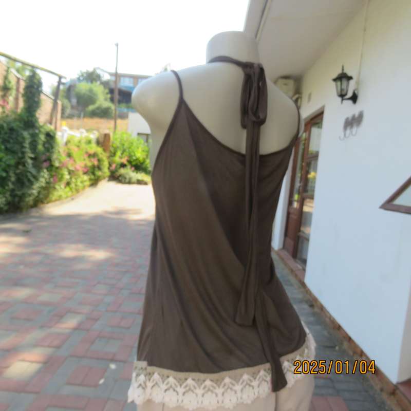 RED MOON uniquely styled brown strappy-halter neck top. Cream cotton frill all around. Size 38-40.