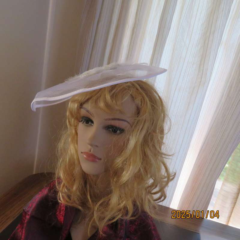 Beautiful styled light cream round mesh fascinator with flower-feathers and beads. Thin satin band,