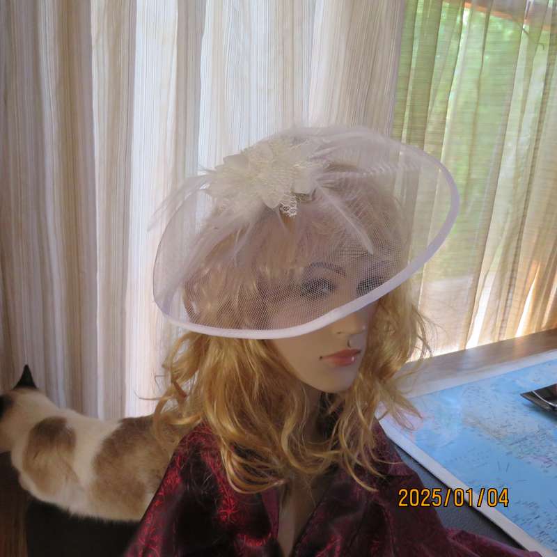 Beautiful styled light cream round mesh fascinator with flower-feathers and beads. Thin satin band,