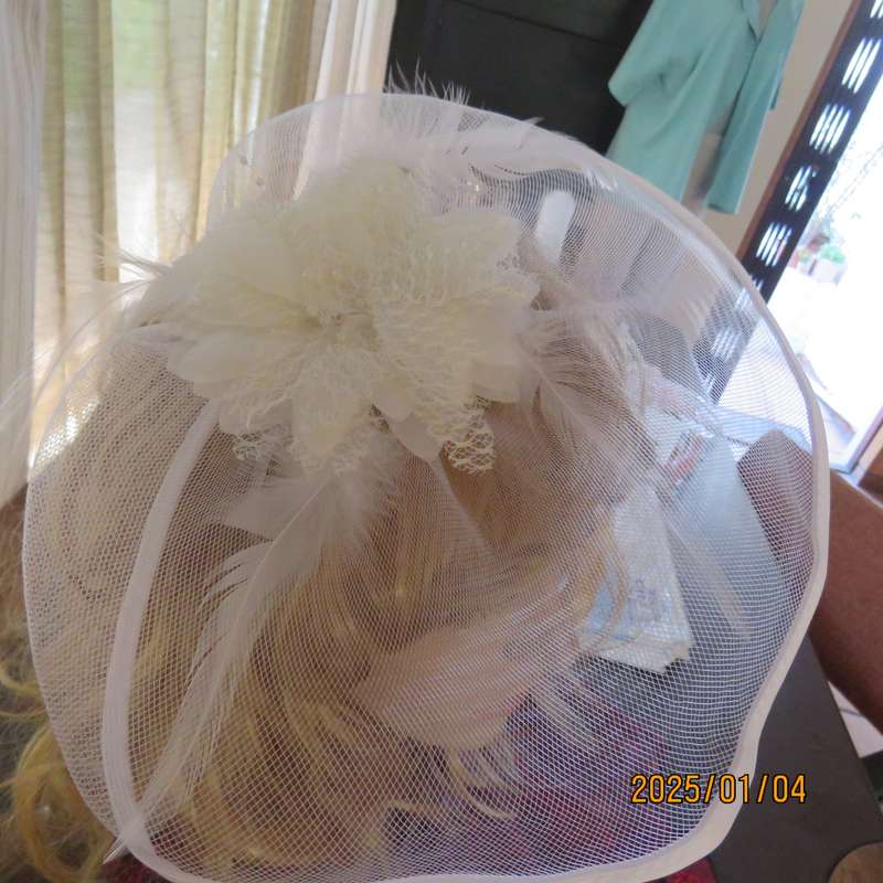 Beautiful styled light cream round mesh fascinator with flower-feathers and beads. Thin satin band,