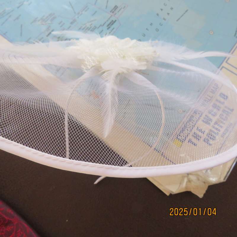 Beautiful styled light cream round mesh fascinator with flower-feathers and beads. Thin satin band,