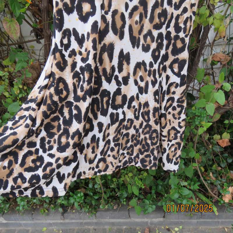 Animal print sleeveless stretch polyester dress with black mesh yoked. Girl 9 to 10yr