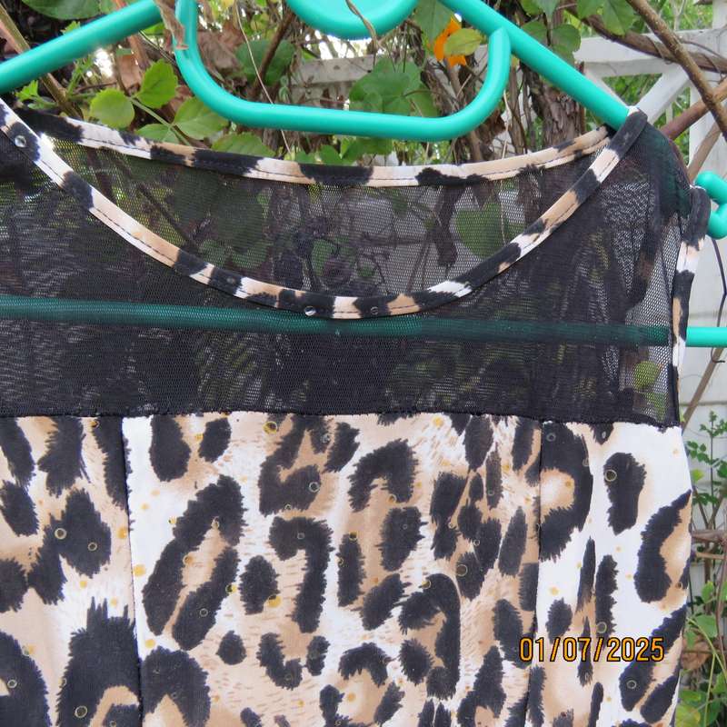 Animal print sleeveless stretch polyester dress with black mesh yoked. Girl 9 to 10yr