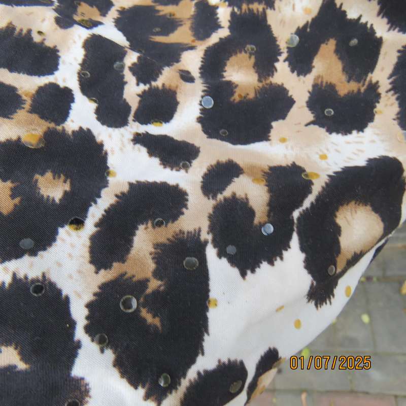 Animal print sleeveless stretch polyester dress with black mesh yoked. Girl 9 to 10yr