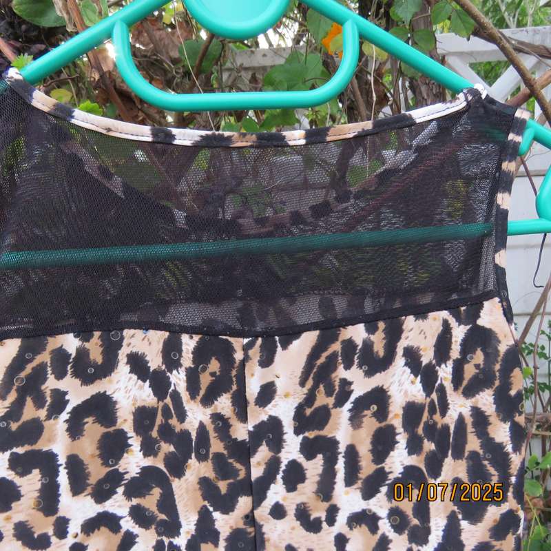 Animal print sleeveless stretch polyester dress with black mesh yoked. Girl 9 to 10yr