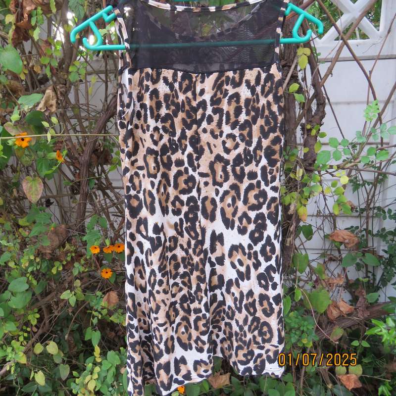 Animal print sleeveless stretch polyester dress with black mesh yoked. Girl 9 to 10yr