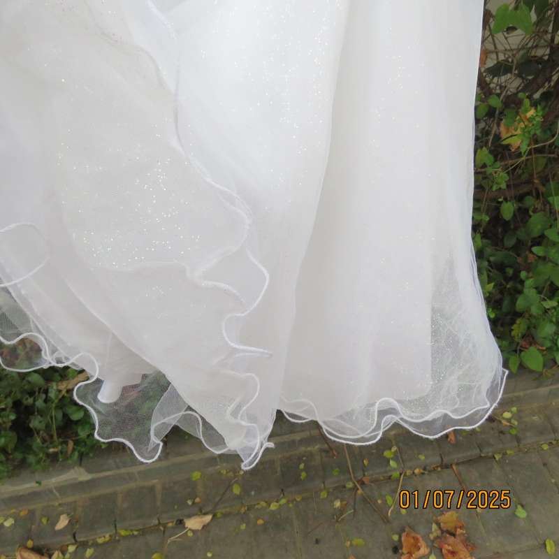 White flower girl tulle dress in 6 layers with adjustable shoulder straps. Size 7-8