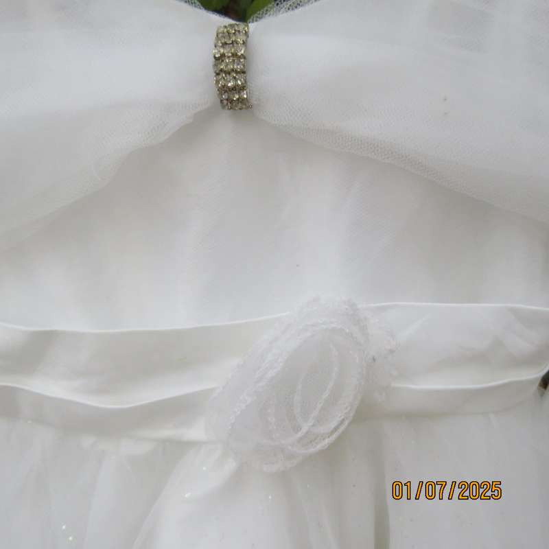 White flower girl tulle dress in 6 layers with adjustable shoulder straps. Size 7-8
