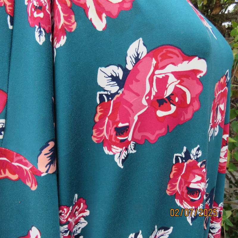 Dark jade slip over stretch polyester top with red-white flowers. Long sleeves. Size 50