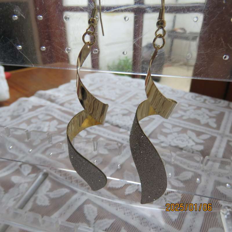 Pair curled light weight golden long earrings with silver glitter. 8cm long. New item