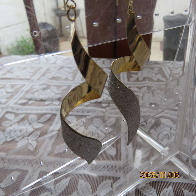 Pair curled light weight golden long earrings with silver glitter. 8cm long. New item