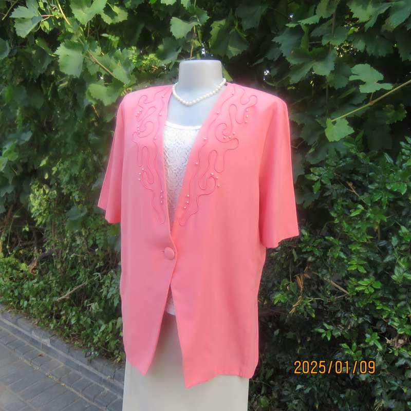 Smart crimson colour richly embellished short sleeve jacket. Viscose-polyester blend.Size 40.As new