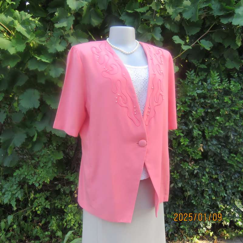 Smart crimson colour richly embellished short sleeve jacket. Viscose-polyester blend.Size 40.As new