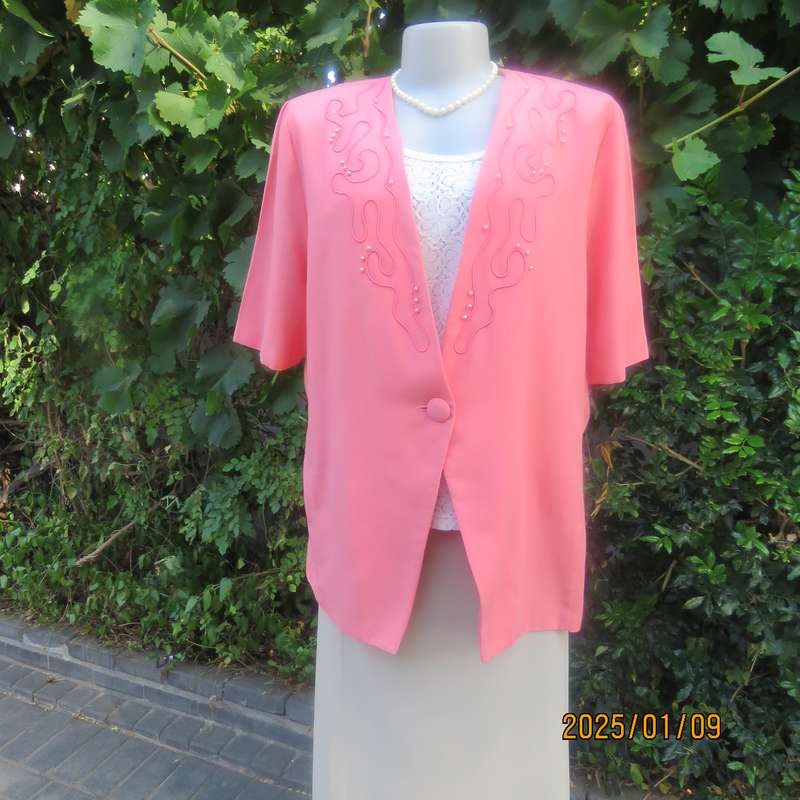 Smart crimson colour richly embellished short sleeve jacket. Viscose-polyester blend.Size 40.As new