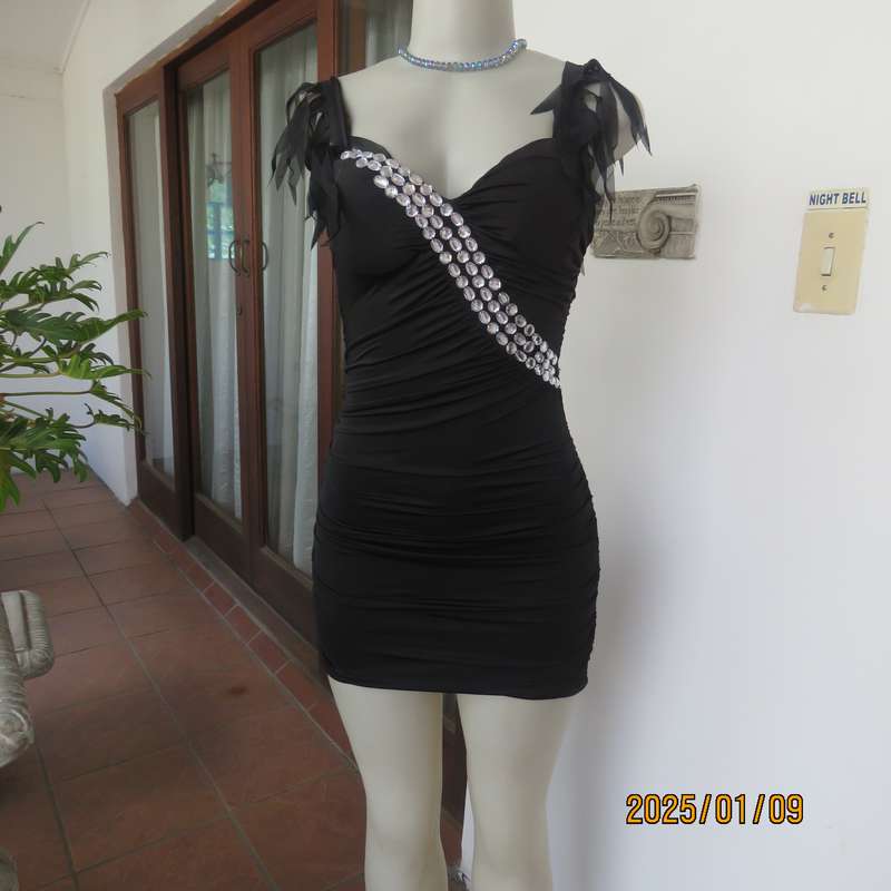 Ultra sexy black 2 layer bodycon dress size 32 from Thailand. Build in bra. Shoulder straps.New cond