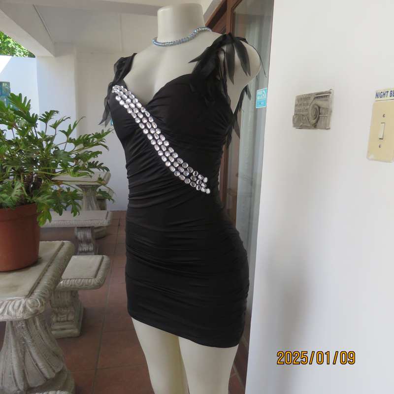 Ultra sexy black 2 layer bodycon dress size 32 from Thailand. Build in bra. Shoulder straps.New cond
