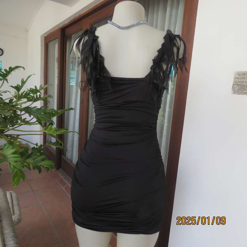 Ultra sexy black 2 layer bodycon dress size 32 from Thailand. Build in bra. Shoulder straps.New cond