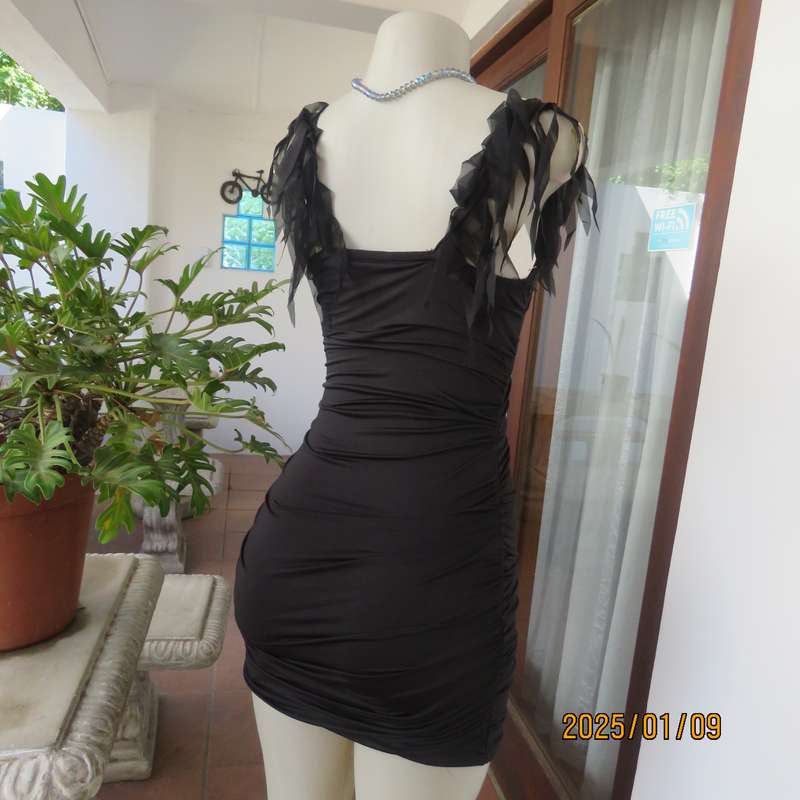 Ultra sexy black 2 layer bodycon dress size 32 from Thailand. Build in bra. Shoulder straps.New cond