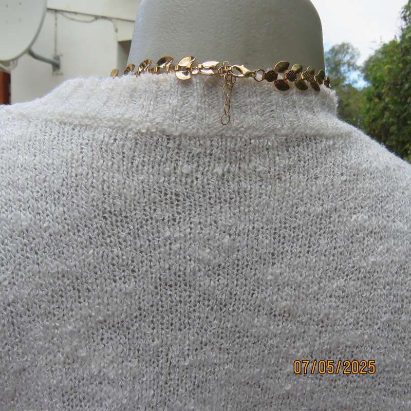 Light cream acrylic knit textured slip over sleeveless top. Front floral embroidery. Size 34