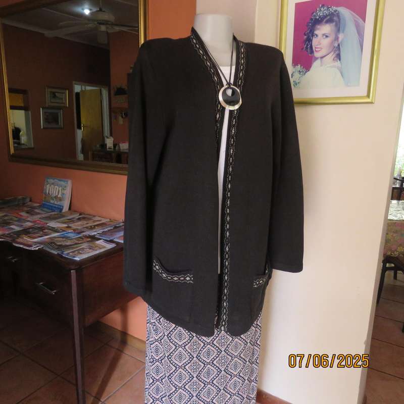 Black acrylic knit long sleeve knitted button down cardigan. Silver thread fronts-pockets. Size 44
