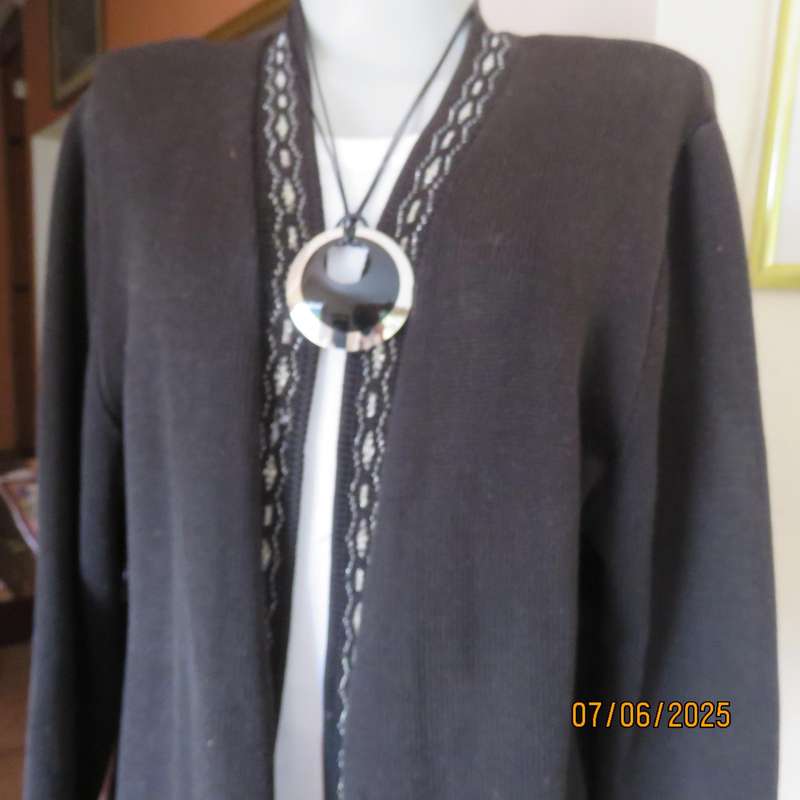 Black acrylic knit long sleeve knitted button down cardigan. Silver thread fronts-pockets. Size 44