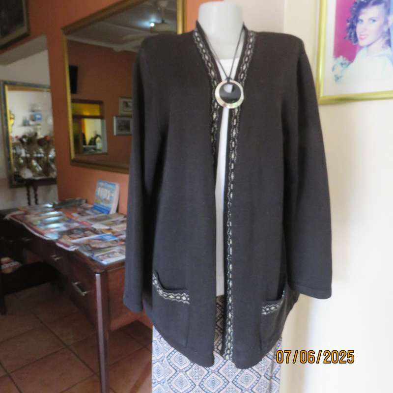 Black acrylic knit long sleeve knitted button down cardigan. Silver thread fronts-pockets. Size 44